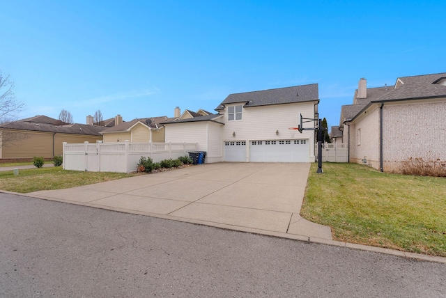 view of front facade featuring a garage and a front yard