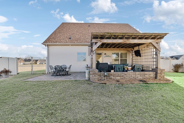 rear view of house featuring a yard, an outdoor living space, and a patio