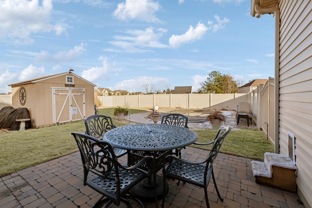 view of patio / terrace with a shed