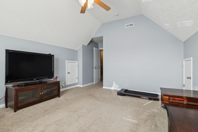 exercise area with ceiling fan, light colored carpet, and lofted ceiling