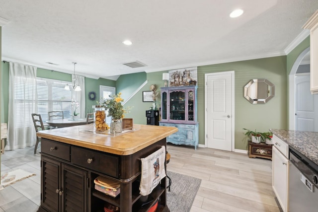 kitchen featuring dishwasher, decorative light fixtures, white cabinetry, ornamental molding, and dark brown cabinets