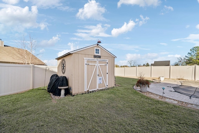 view of outbuilding with a lawn