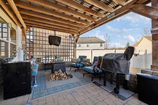 view of patio / terrace with area for grilling and an outdoor fire pit