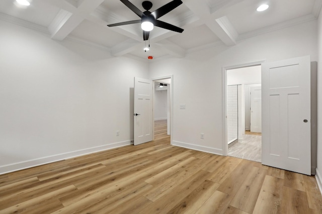 unfurnished bedroom with coffered ceiling, beam ceiling, and light hardwood / wood-style floors