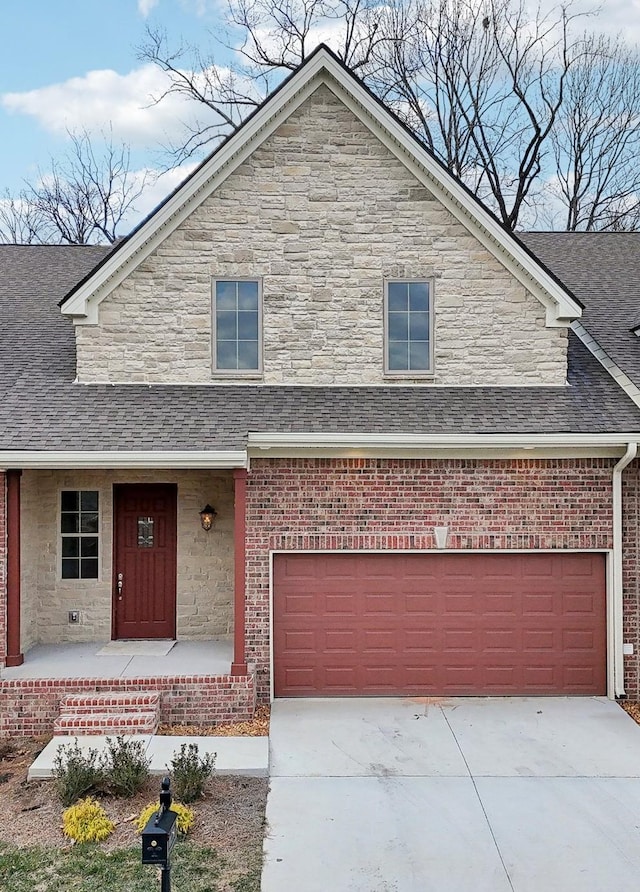 view of front of home with a garage and a porch