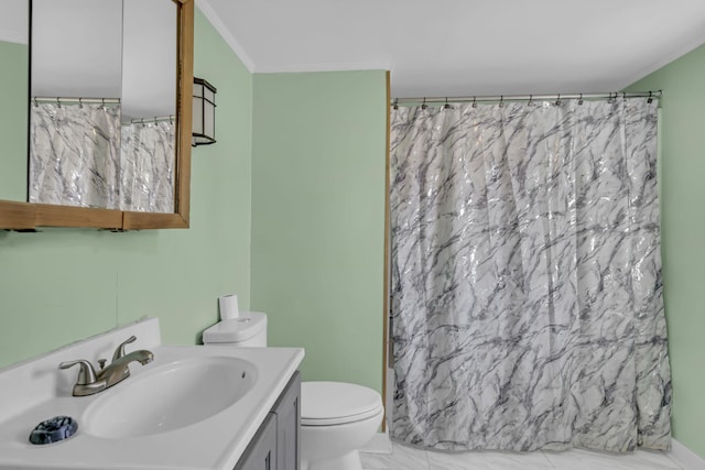 bathroom featuring toilet, vanity, crown molding, and walk in shower