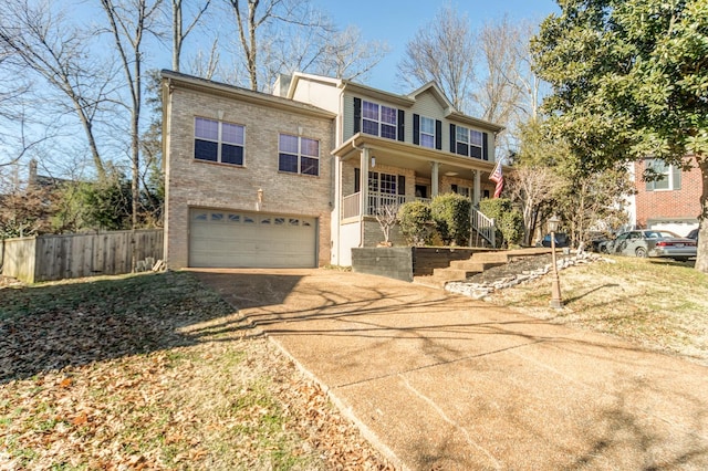 view of front of property featuring a garage and covered porch