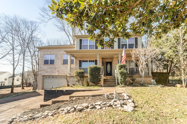 view of front of home featuring a porch and a garage