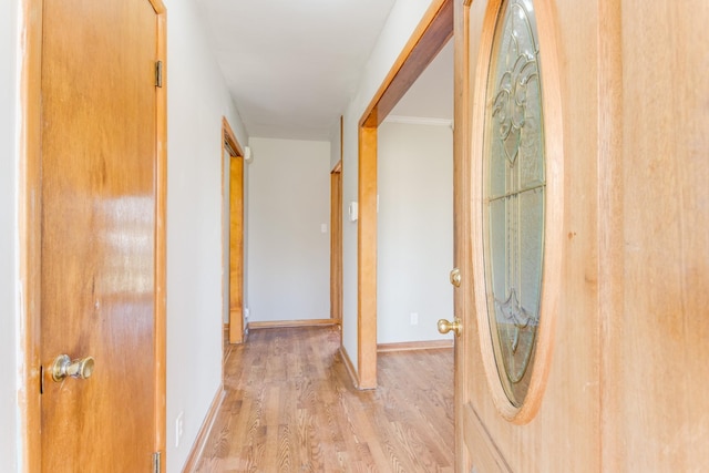 corridor featuring light hardwood / wood-style floors