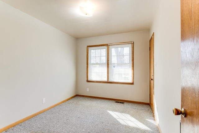 spare room with carpet floors