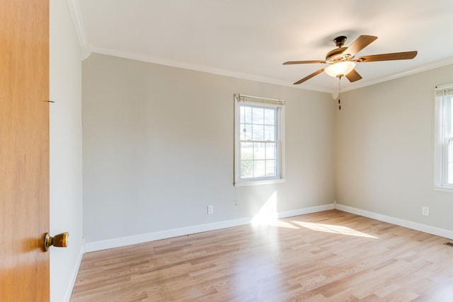 empty room with light hardwood / wood-style floors, ornamental molding, and ceiling fan