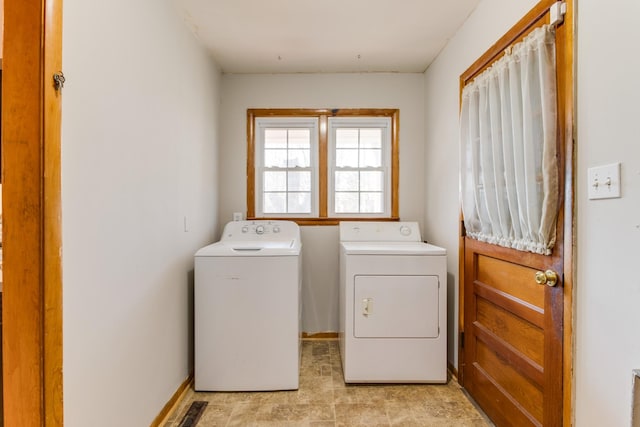 laundry room featuring washer and clothes dryer