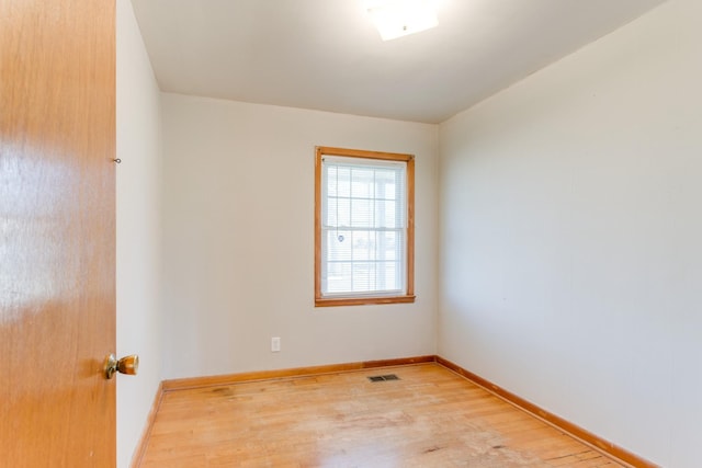 unfurnished room with light hardwood / wood-style flooring