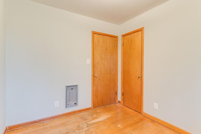 unfurnished room featuring light hardwood / wood-style floors