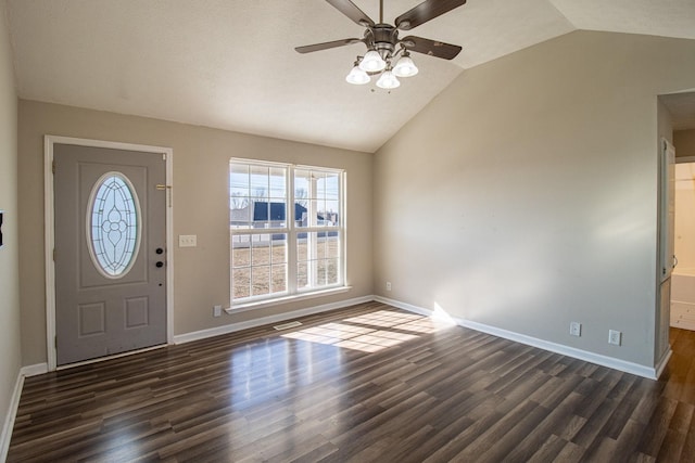 entryway featuring dark wood-type flooring, ceiling fan, and vaulted ceiling