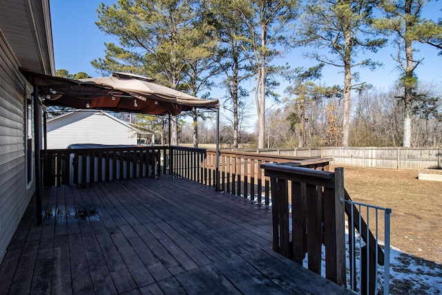 wooden deck with a lawn