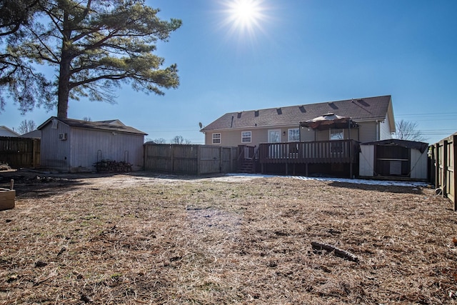 view of yard with a shed and a wooden deck