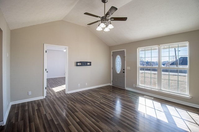 entryway with ceiling fan, dark hardwood / wood-style flooring, and vaulted ceiling