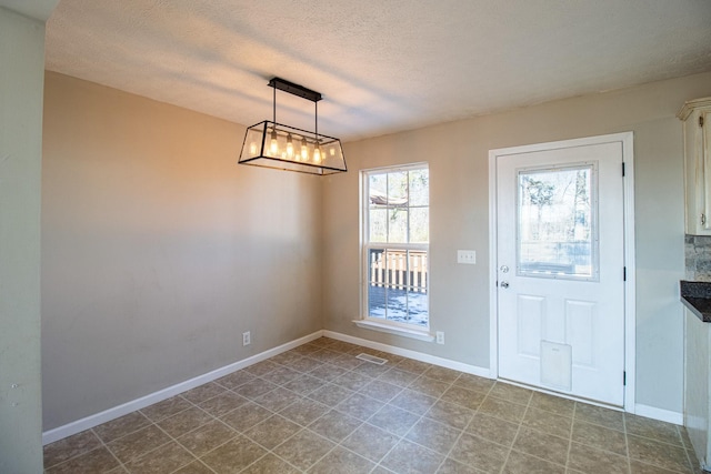 interior space with a textured ceiling