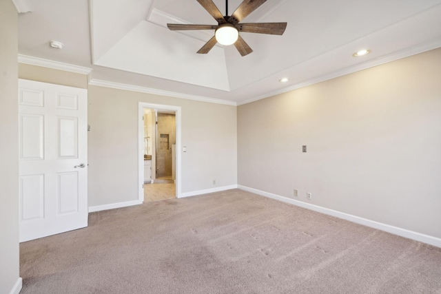 empty room featuring light carpet, ceiling fan, crown molding, and a tray ceiling