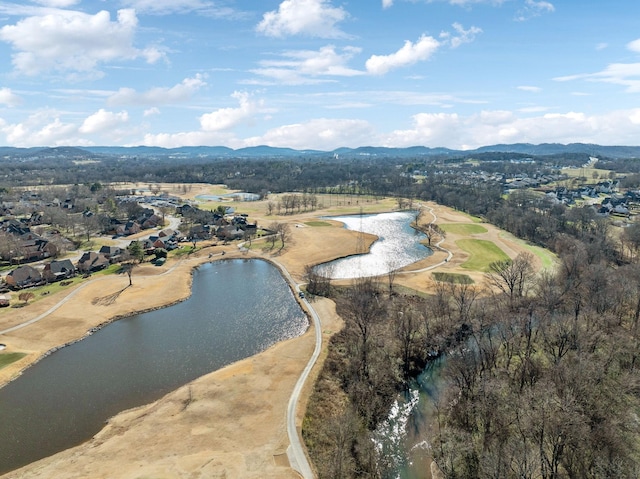 drone / aerial view with a water and mountain view