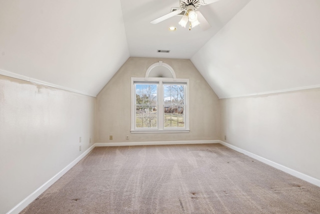 additional living space featuring light carpet, ceiling fan, and lofted ceiling