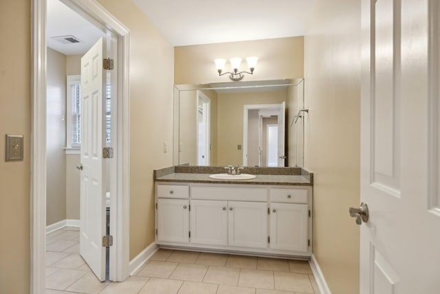 bathroom featuring vanity and tile patterned flooring