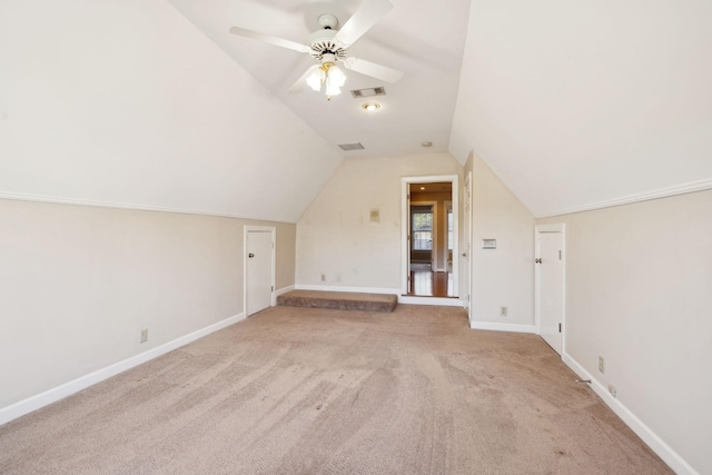 bonus room featuring vaulted ceiling, ceiling fan, and light colored carpet