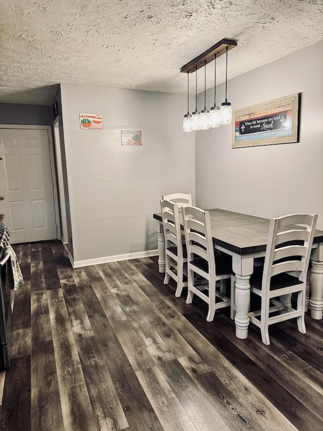 unfurnished dining area with a textured ceiling and dark hardwood / wood-style flooring