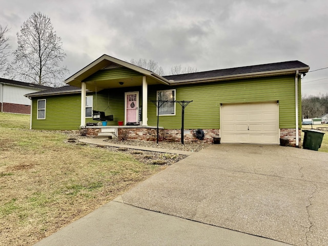 ranch-style house featuring a front yard, a garage, and a porch