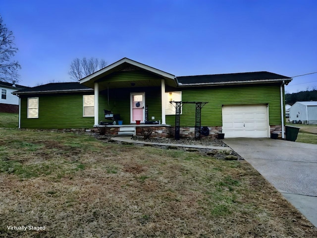 single story home featuring covered porch and a garage