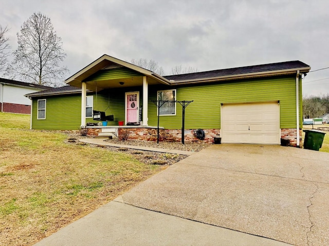 ranch-style home with a front lawn, covered porch, and a garage