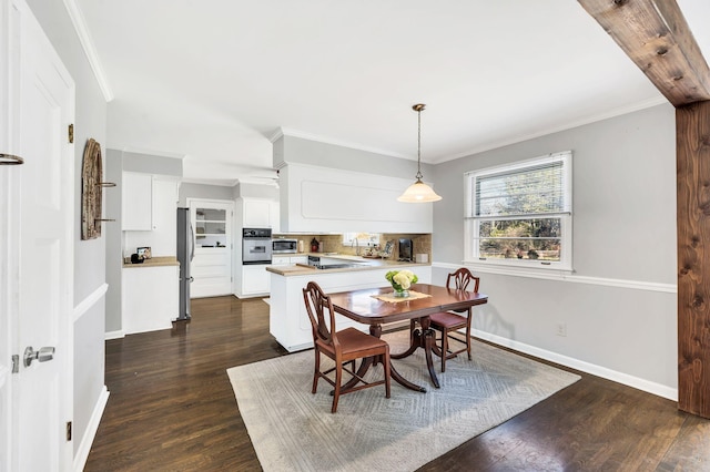 dining area with dark hardwood / wood-style flooring, sink, and ornamental molding