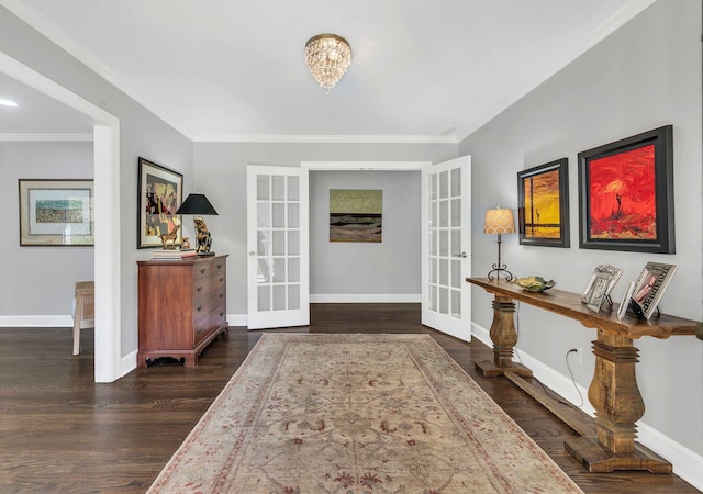 foyer entrance featuring a chandelier, french doors, dark hardwood / wood-style floors, and ornamental molding