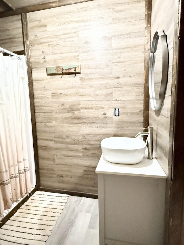 bathroom featuring wood-type flooring and vanity