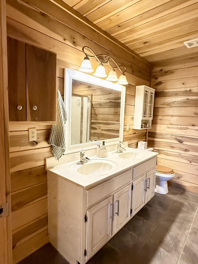 bathroom featuring vanity, wooden ceiling, tile patterned floors, and wooden walls