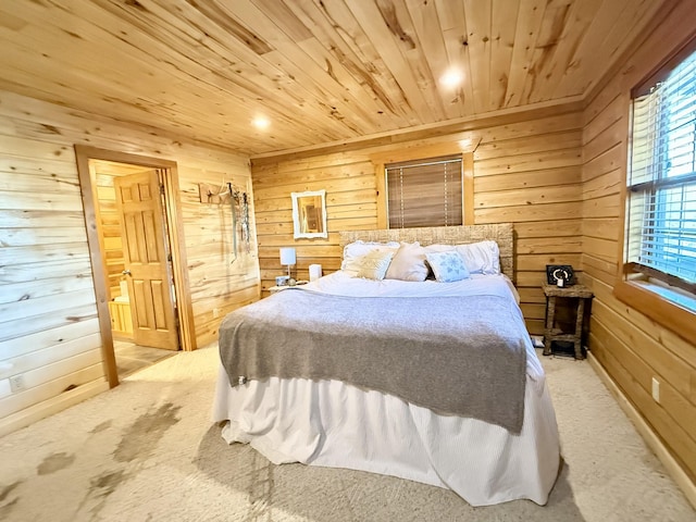 carpeted bedroom with wood ceiling and wooden walls