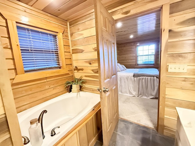 bathroom with wooden ceiling, tile patterned flooring, wood walls, and a washtub