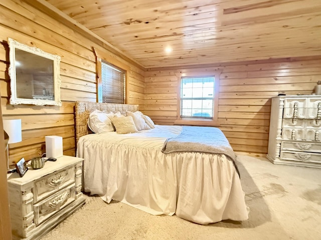 bedroom featuring wooden ceiling, carpet flooring, and wooden walls