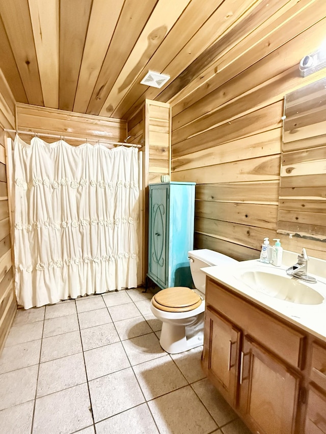 bathroom with toilet, wood ceiling, tile patterned floors, and wooden walls