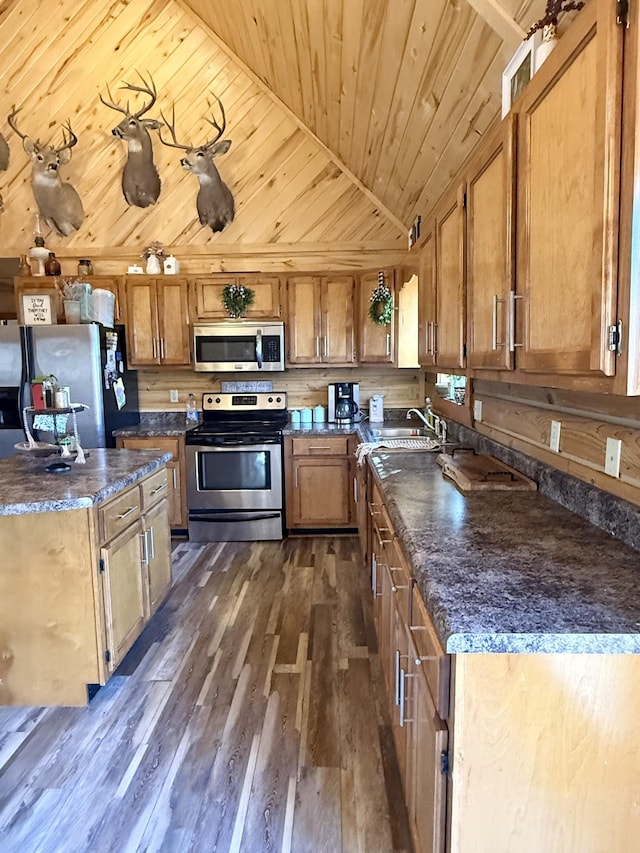 kitchen with wood ceiling, stainless steel appliances, dark wood-type flooring, lofted ceiling, and sink