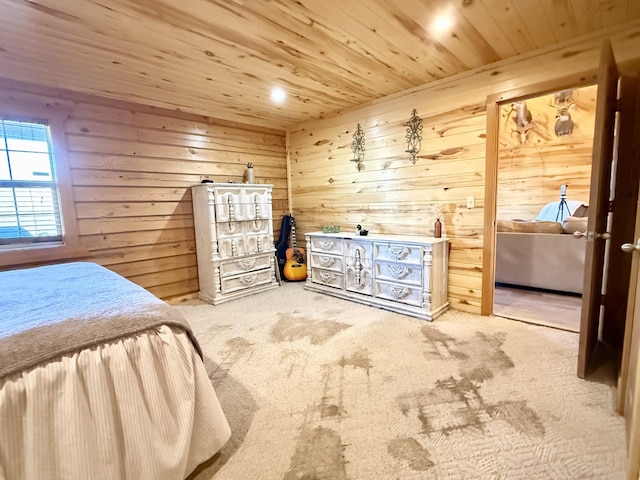 carpeted bedroom with wooden ceiling and wood walls