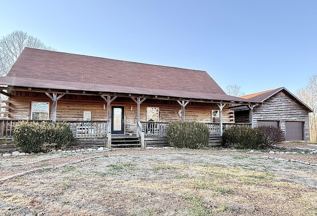 log cabin featuring a garage