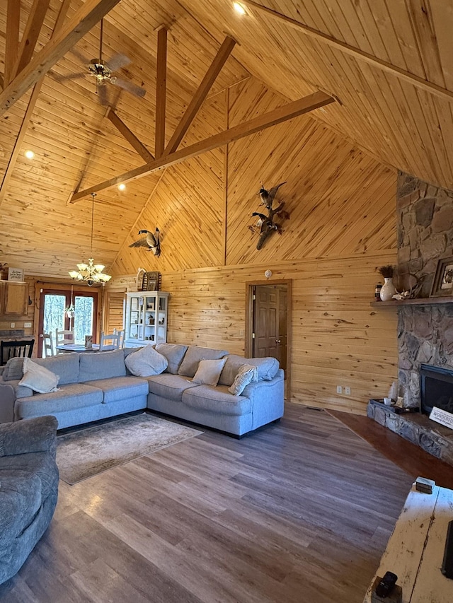 unfurnished living room with high vaulted ceiling, wood-type flooring, and wood ceiling