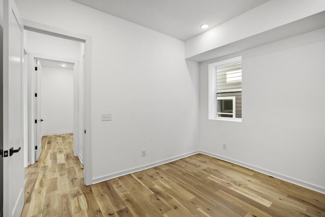 unfurnished room with light hardwood / wood-style floors