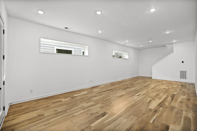 basement featuring light wood-type flooring