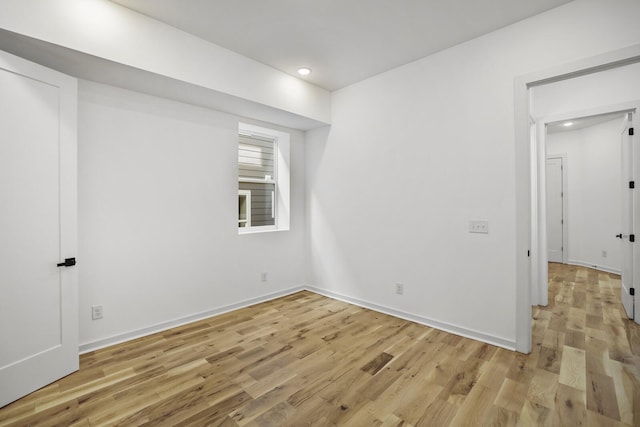 spare room featuring light hardwood / wood-style flooring