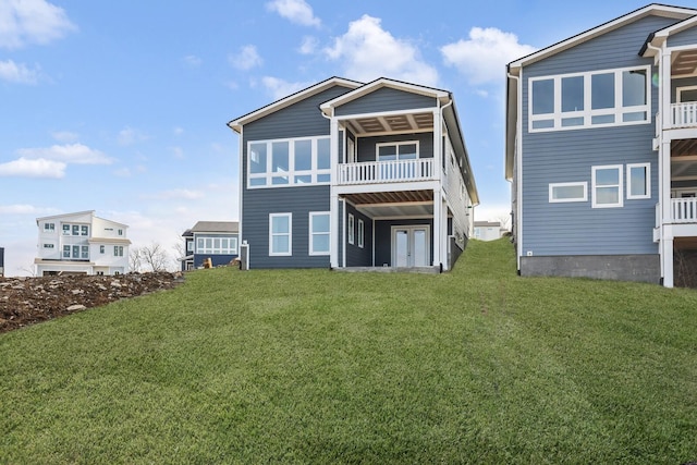 rear view of house with a lawn