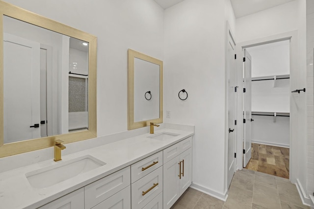 bathroom featuring tile patterned flooring and vanity