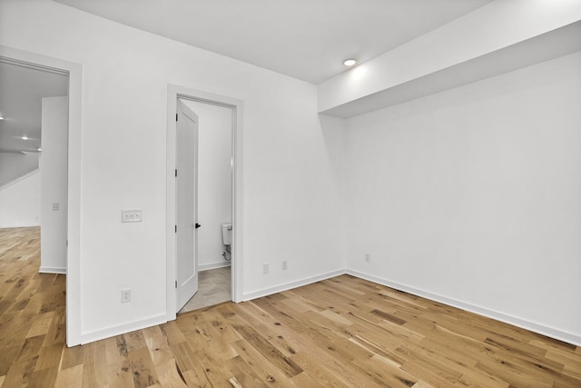 empty room with wood-type flooring